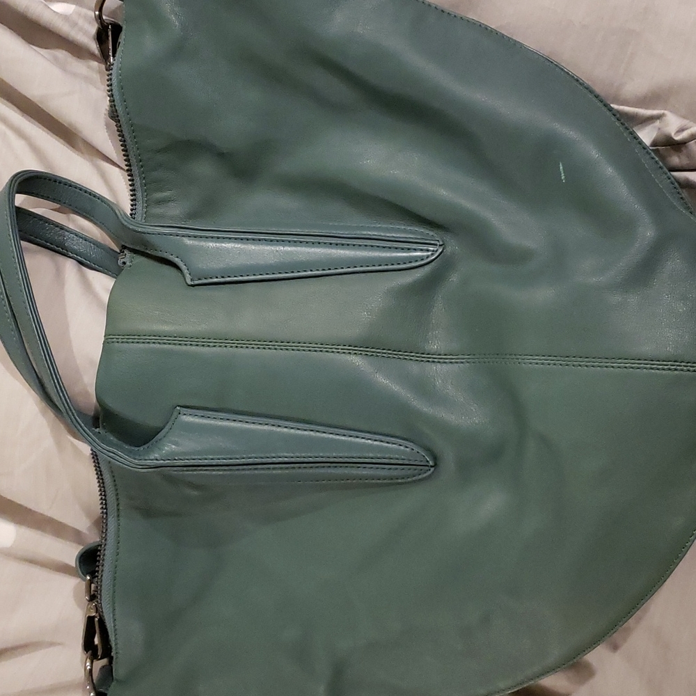 Pour la Victoire teal color. Condition as is.